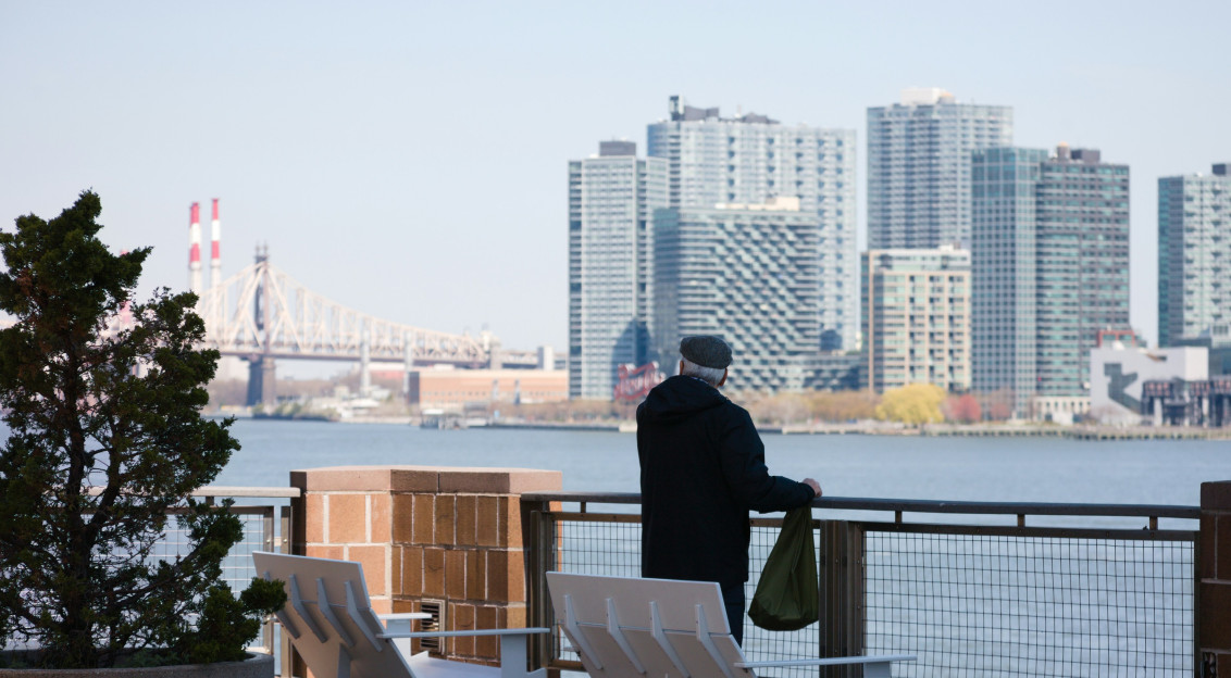 Photo by Unsplash An illustrative photo of a man standing on a balcony.