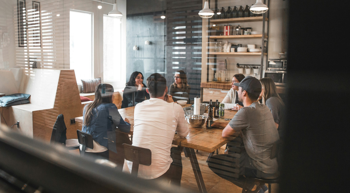 Image by Unsplash An illustrative photo of people sitting in the office talking.