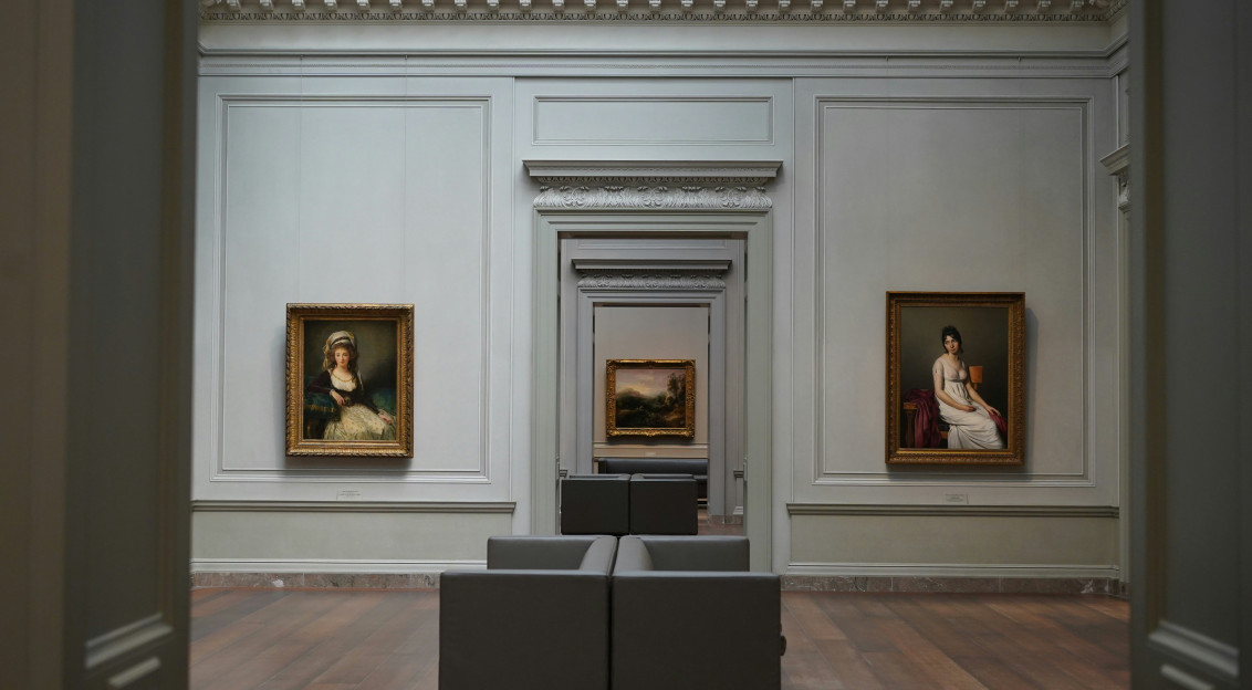 An illustrative photo of paintings in a museum.