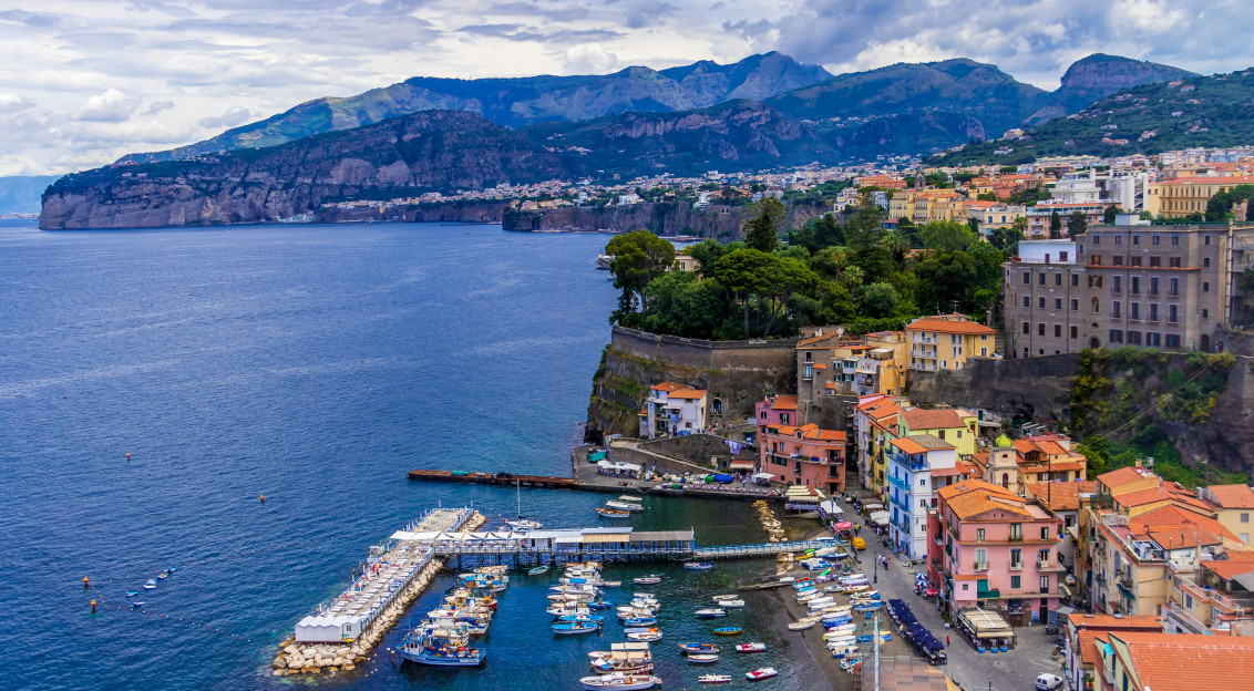 Photo by Unsplash An illustrative photo of city buildings near body of water.