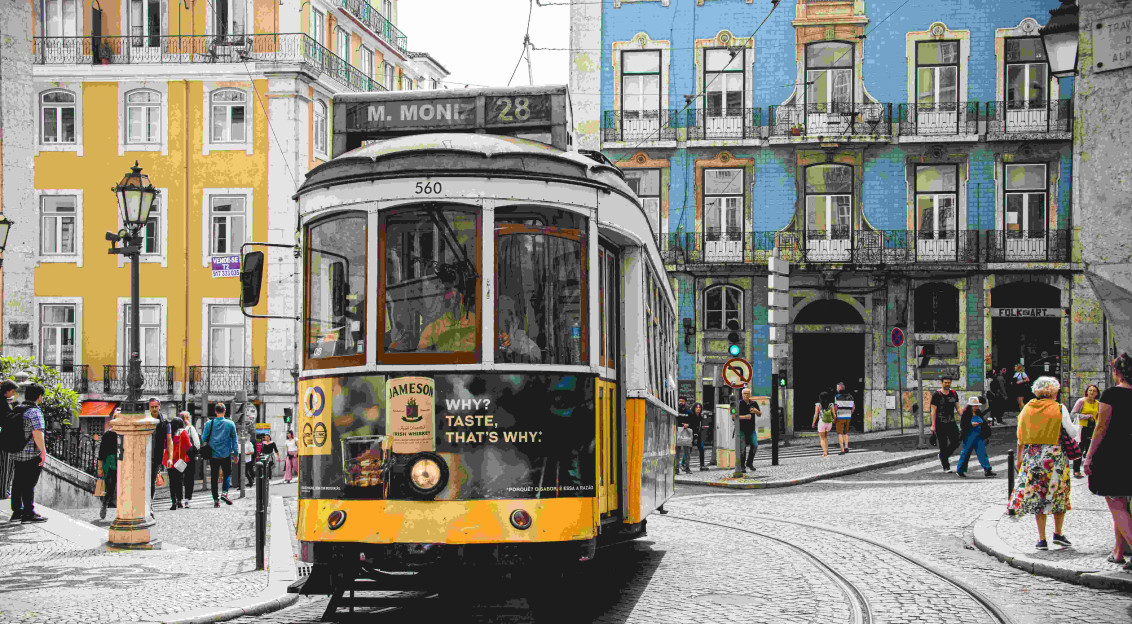 Photo by Unsplash An illustrative photo of a yellow and white tram on road near white concrete building.