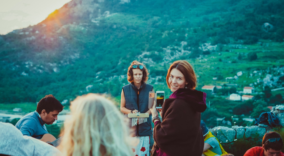 An illustrative photo of a group of people having a party in the mountains.