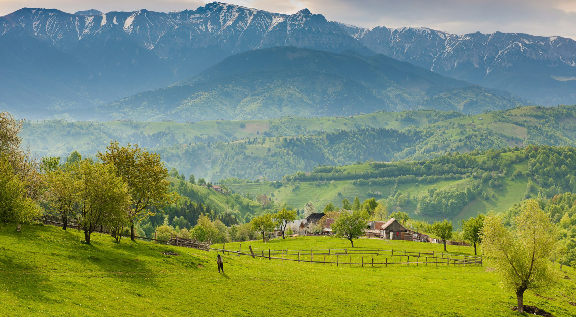 An illustrative photo of a farm in the mountains.
