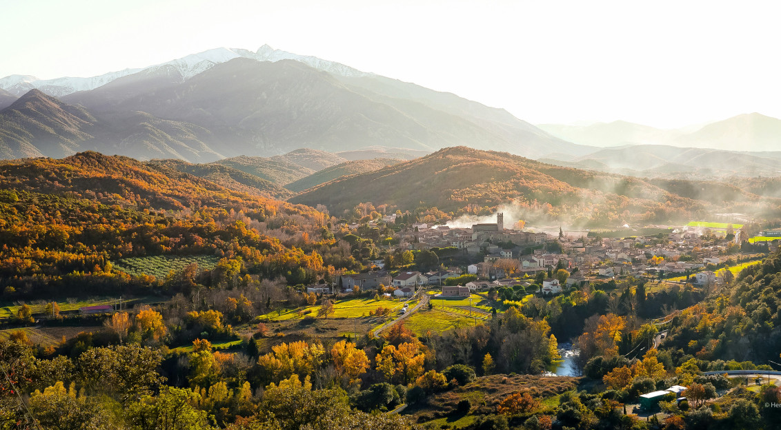Photo by Unsplash An illustrative photo of a town surrounded by mountains.
