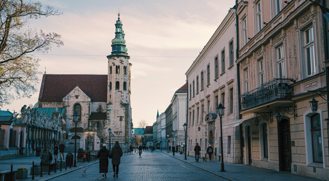 Photo by Unsplash An illustrative photo of people walking on sidewalk near buildings.