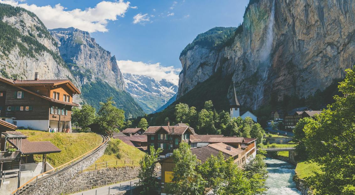 An illustrative photo of houses near valley.