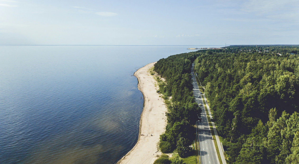 Photo by Unsplash An illustrative photo of a road beside a sea.