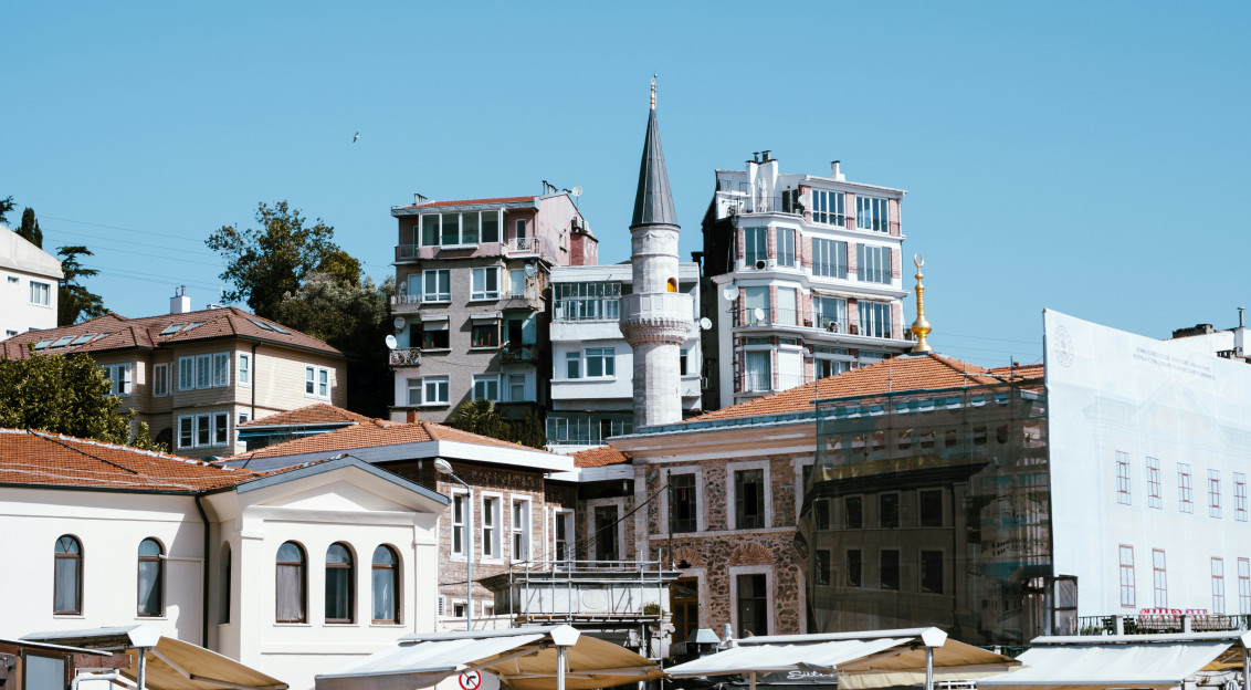 Photo by Unsplash An illustrative photo of buildings sitting on the side of a road.