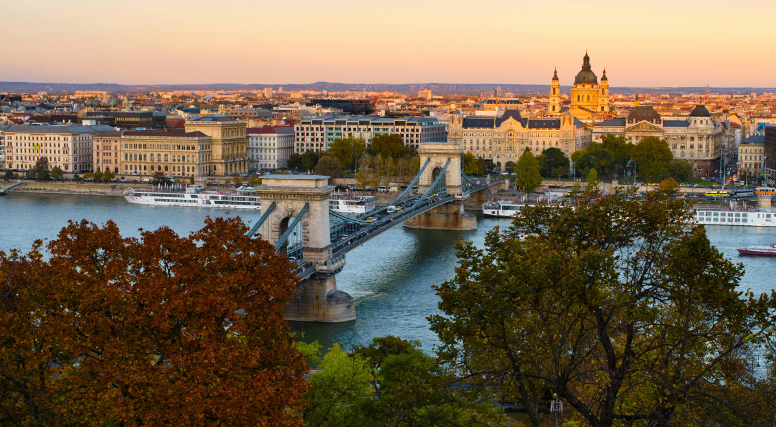 Photo by Unsplash An illustrative photo of a bridge over a river near a city.