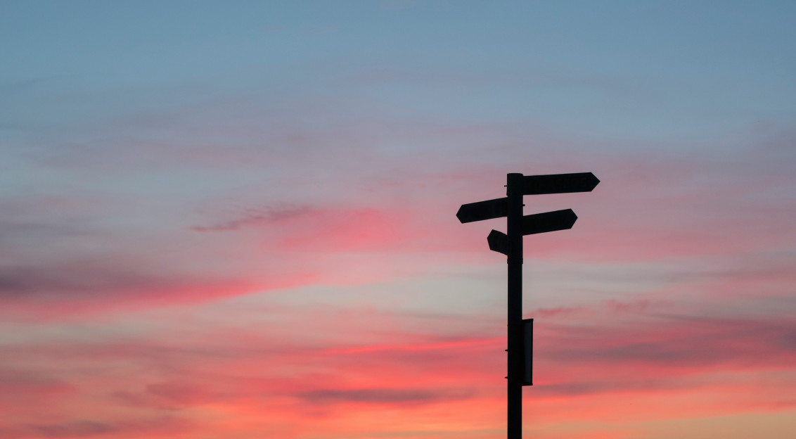 road sign at sunset