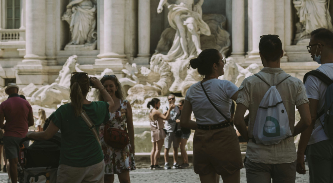 People walking next to Di Trevi Fountain in Rome