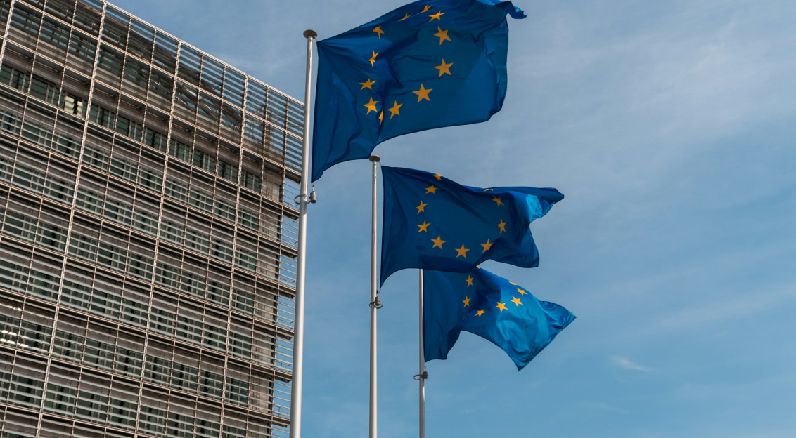Three European Commission flags in a row.  