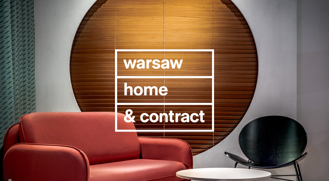 Interior scene with modern furniture and the text “Warsaw Home & Contract” displayed on a circular backdrop.