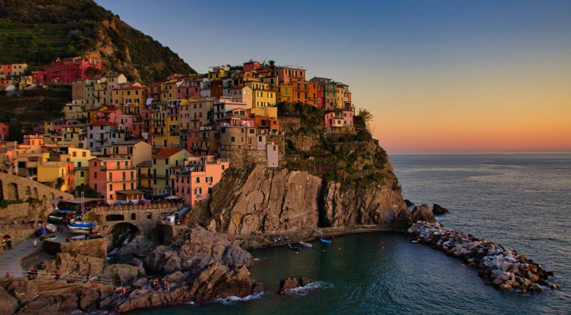 city-buildings-on-cliff-beside-sea-during-daytime