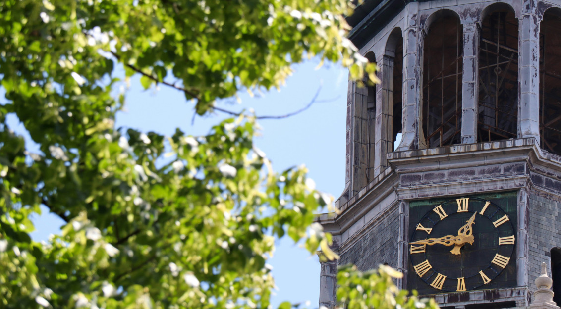 a-large-clock-tower-with-a-clock-on-each-of-its-sides